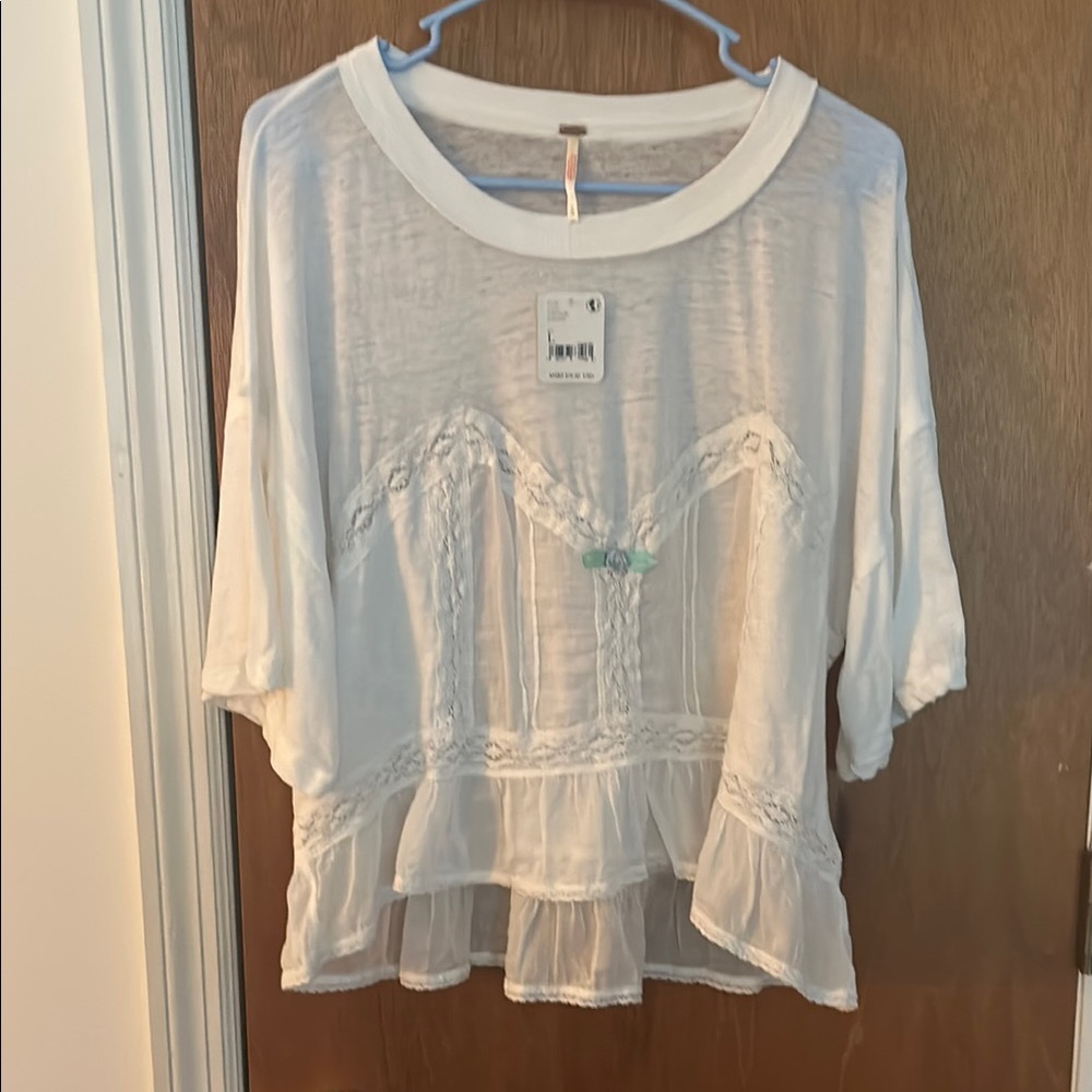White Boxy Blouse with 3/4 Sleeves and Ruffled Hem